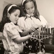 Vic_Alhadeffs_daughters_Michal_and_Daniella_light_the_Chanukah_candelabra._1990..jpg