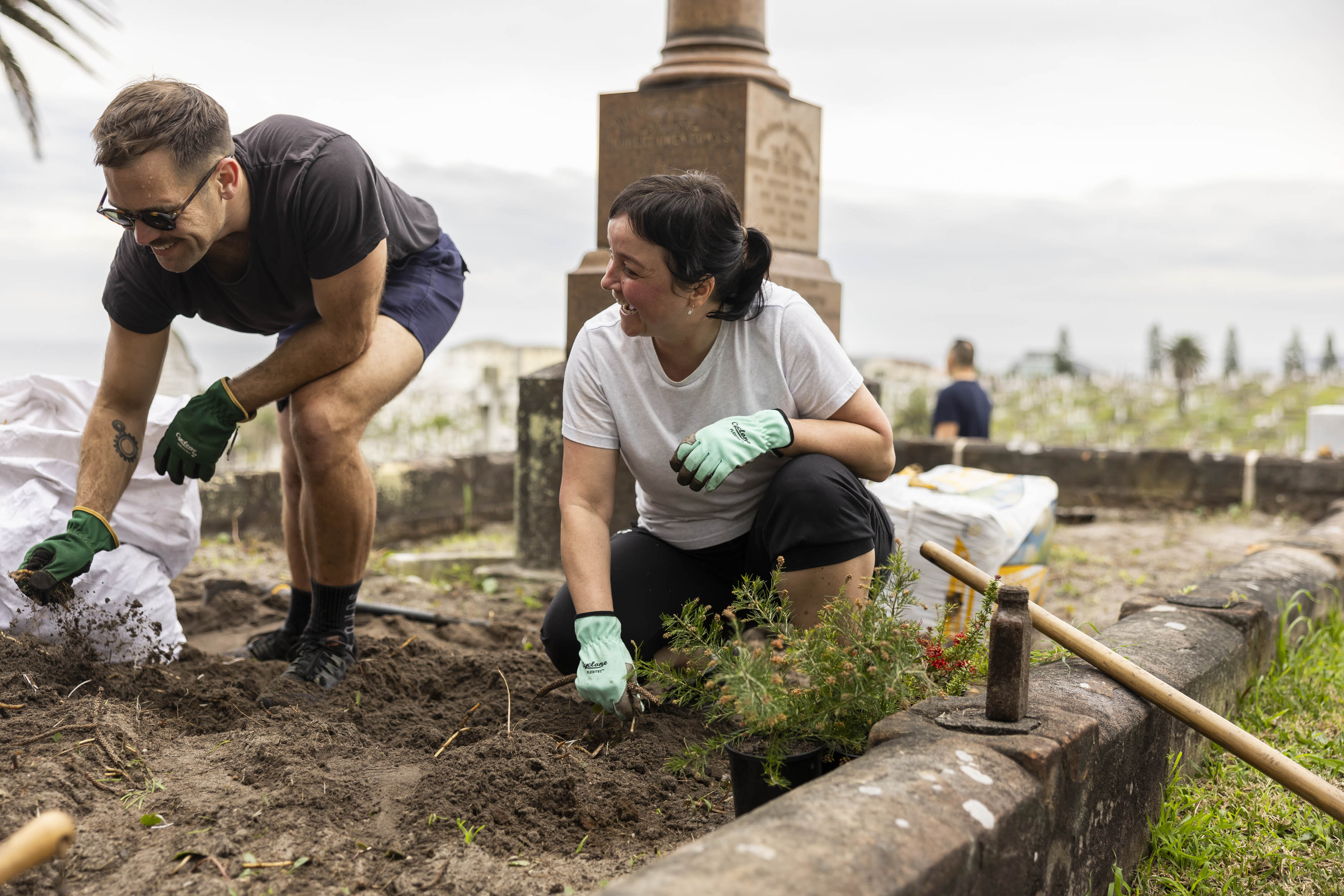 man and woman gardening