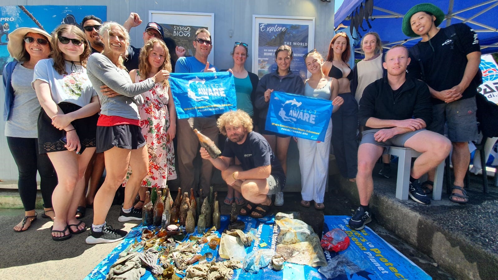 Group of divers against debris